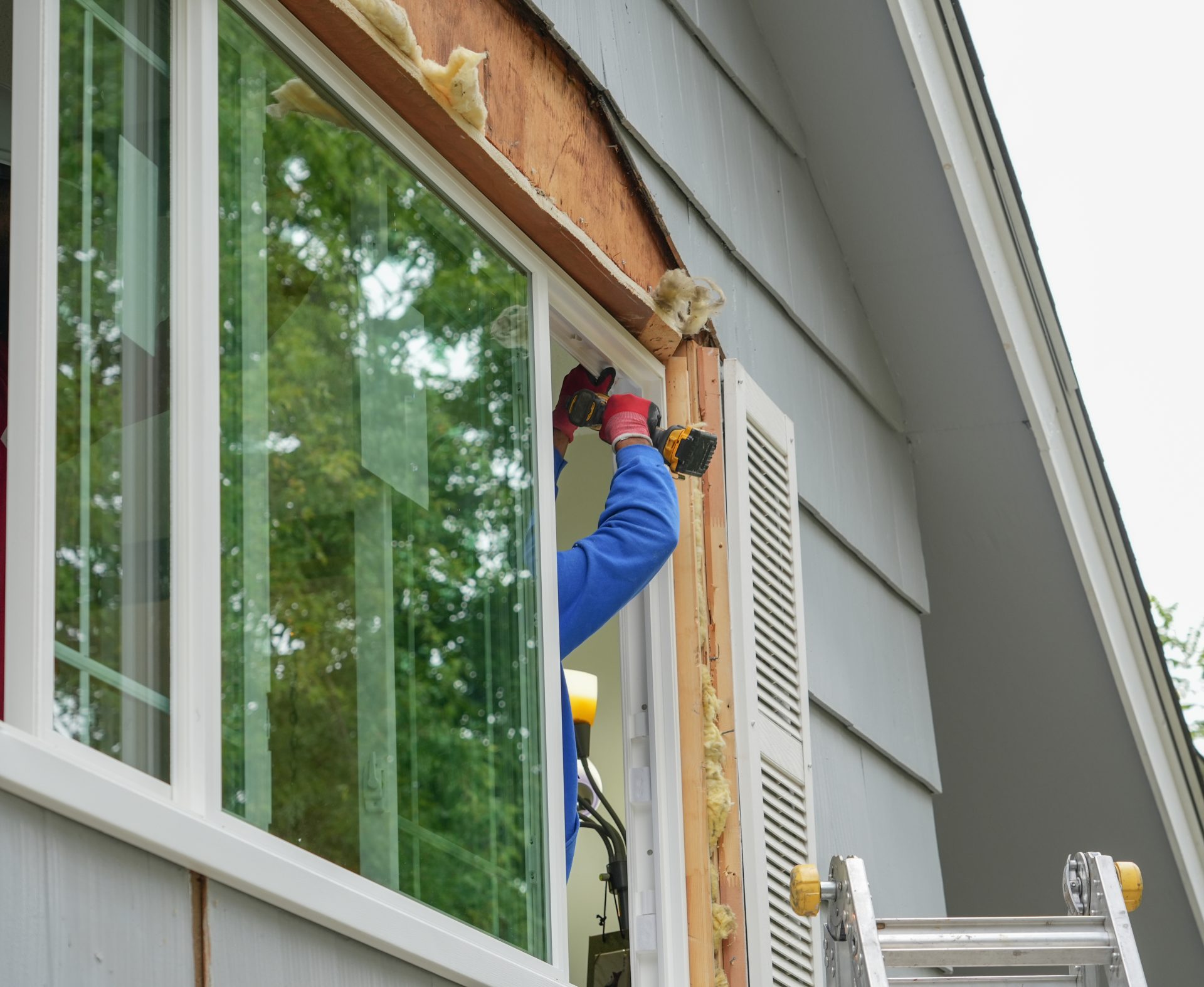 contractor-working-on-replacing-the-window-of-the-house